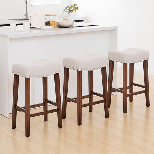 PrimeZone Counter Height Bar Stools Set of 3 - Backless Saddle Barstools with 4.3" Thick Upholstered, Nailhead Trim Linen Fabric & Solid Wood Legs, 26 Inch Counter Stools for Kitchen Island, Beige